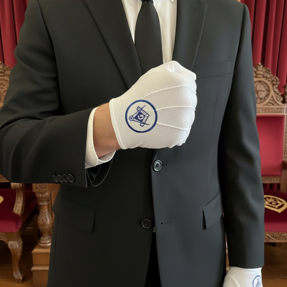 White cotton gloves featuring navy Square &amp; Compasses and G within circle